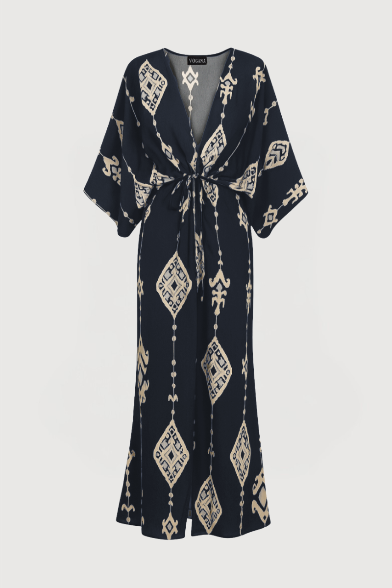 Kaftán midi en color marino con mangas anchas y escote en V. Se cierra con lazada en el frontal.