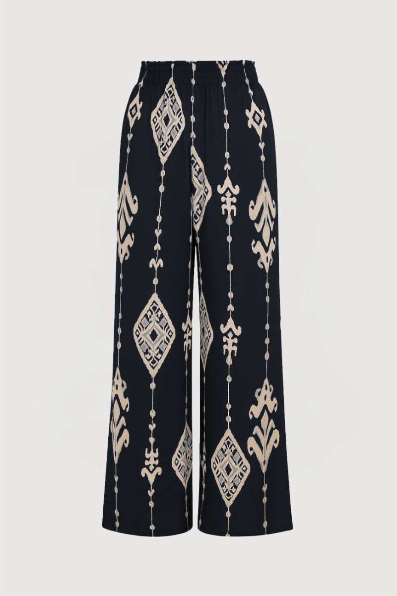 Pantalón fluido recto en color azul marino con cinturilla elástica.